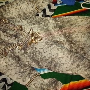 Super cute sheer blouse.